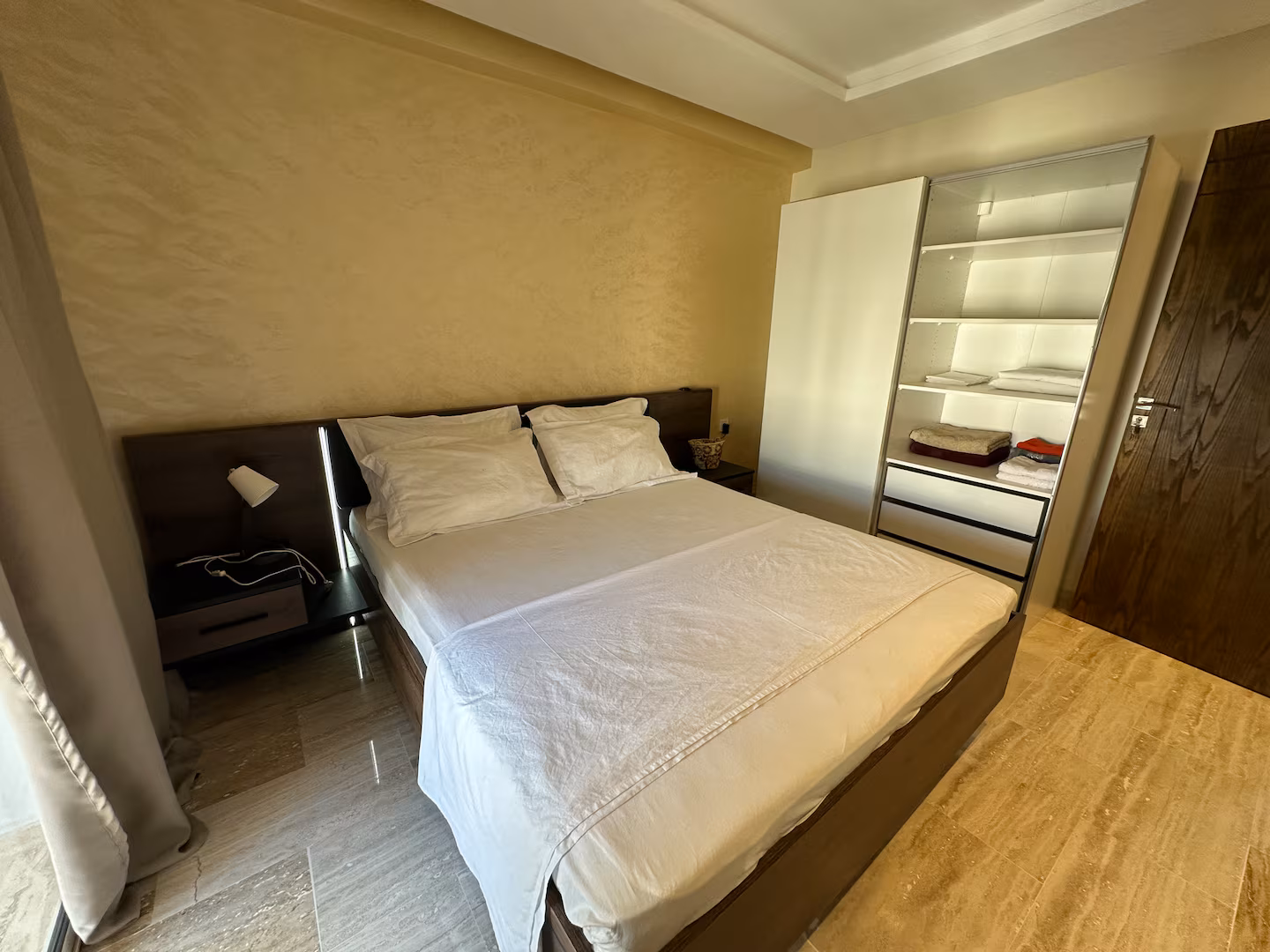 Bedroom with double bed and wardrobe