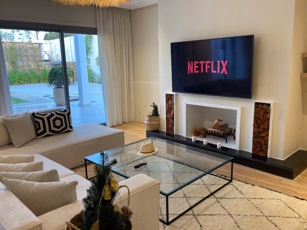 Living room with fireplace and garden view